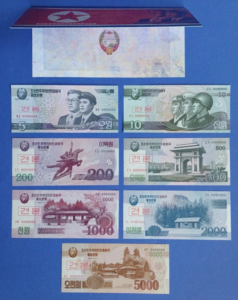 7 different uncirculated specimen notes w/folder, North Korea (DPRK), 2002-13